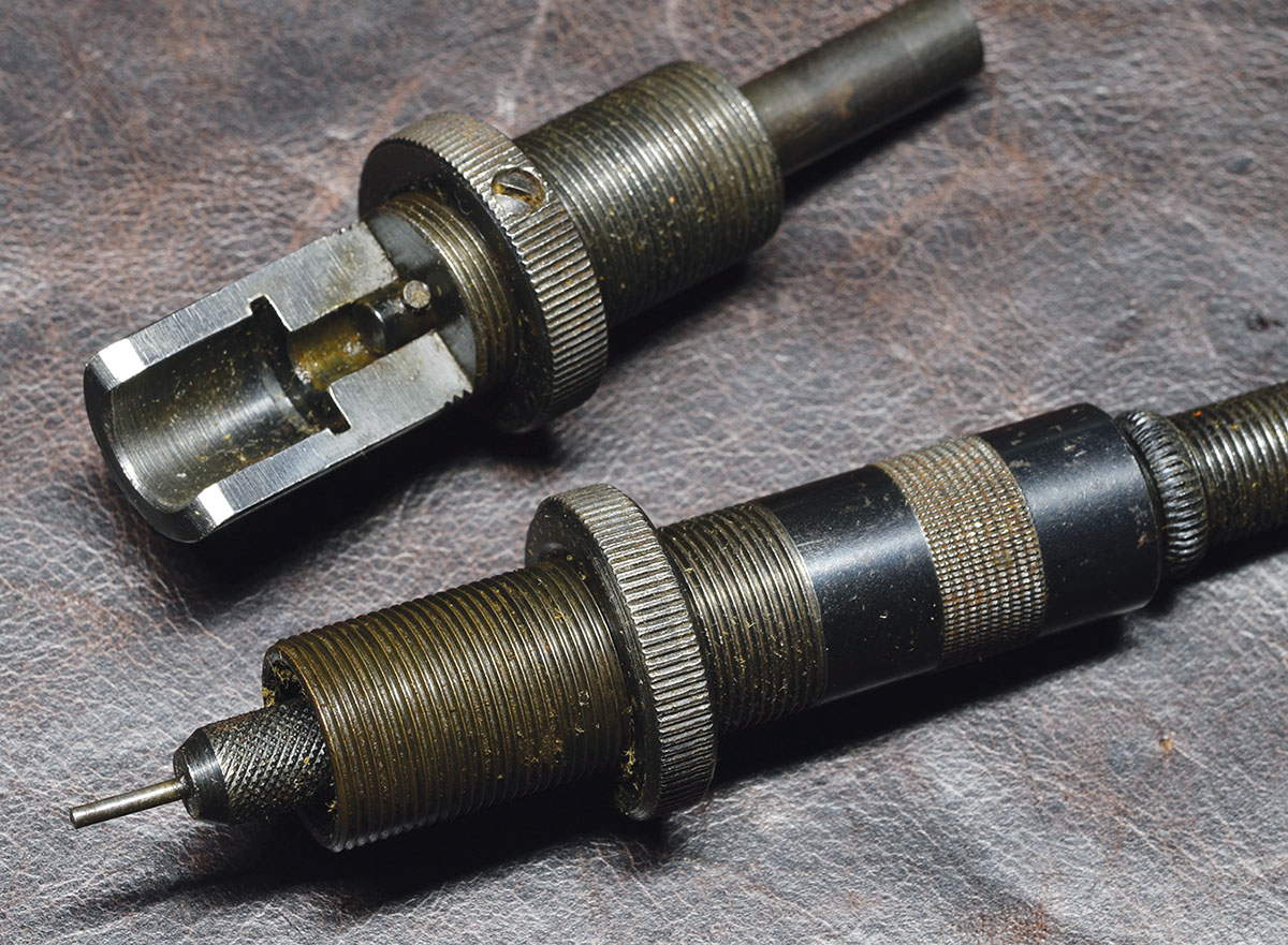 The depriming and repriming dies for the No. 310 tong (or nutcracker) tool. They are quite sophisticated for their time, with knurled lock nuts equipped with set screws.